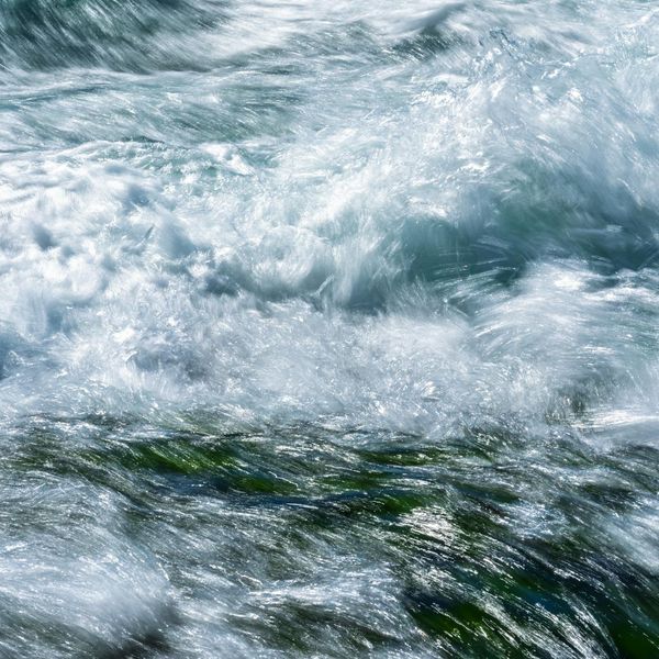Abstract image of smooth ocean waves flowing.