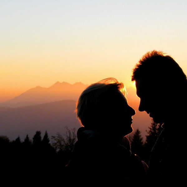 Silhouette of a person at sunrise feeling energized.